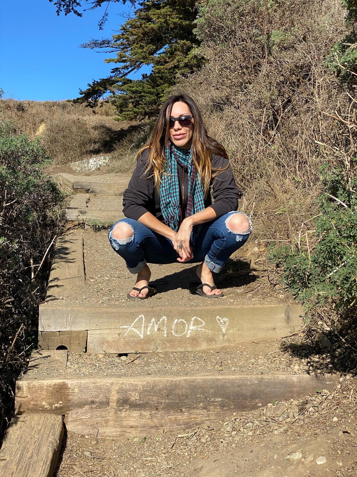 Lara on outdoor stairs in Bodega Bay