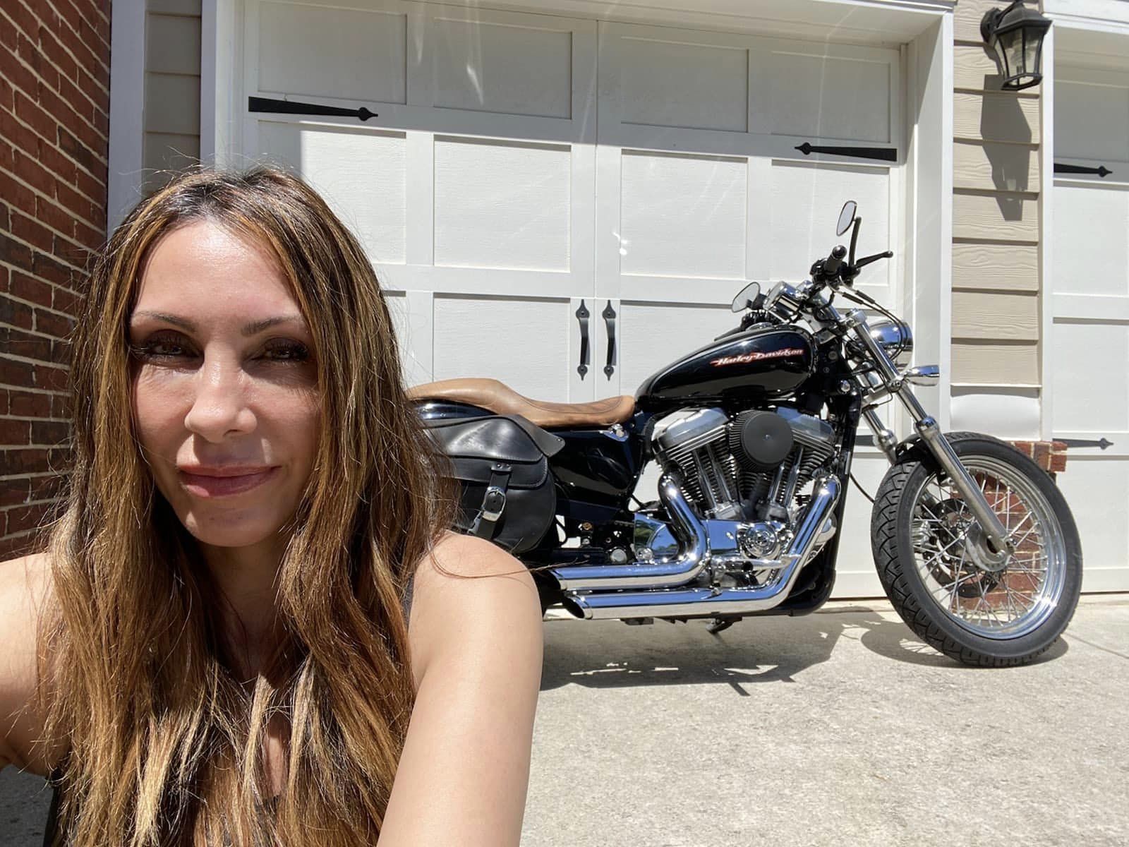 Lara with her Harley Sportster